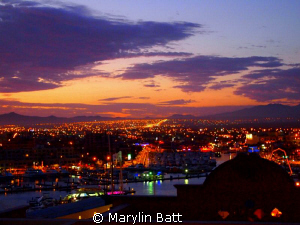 Cabo Sunset. View from the pool over the marina after a d... by Marylin Batt 